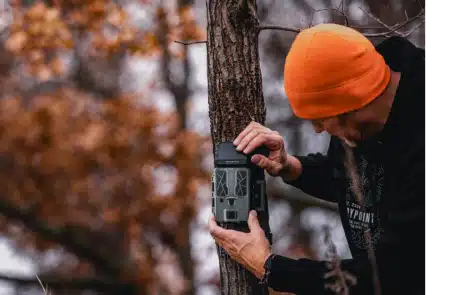 force-pro-s2-feature - North American Bow Hunter Spypoint trail camera being set up in the woods