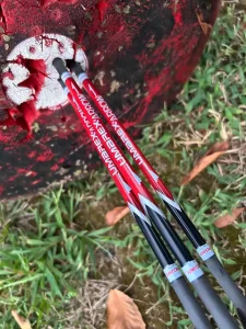 accuracy - North American Bow Hunter Three Umarex NitroJavelin arrows grouped tightly in a target during accuracy testing